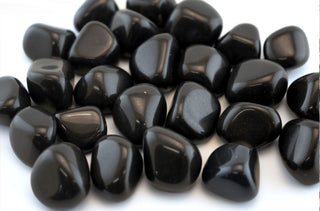 Smooth, glossy black stones often used in meditation and jewelry.