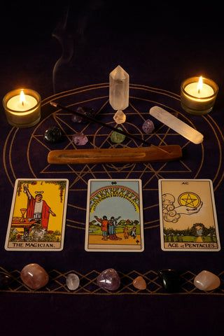 Tarot cards on an altar with crystals and incense