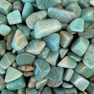 A polished Amazonite crystal showing blue-green color with white streaks