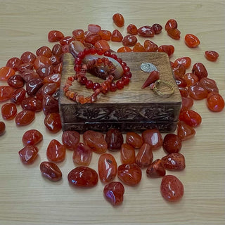 	•	Orange-red Carnelian gemstone glowing with vitality and grounding energy.