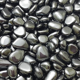 	•	Polished Hematite stone reflecting light with a metallic sheen