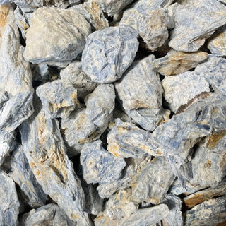Blue Kyanite blades aligned on a white background