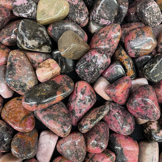 Pink and black Rhodonite crystal with heart-healing energy