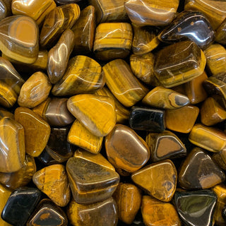 Golden-brown Tiger’s Eye crystal with shimmering bands of light.