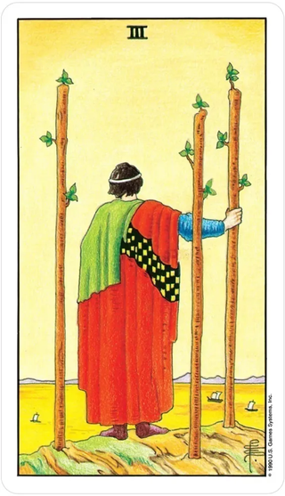 Tarot card with a figure holding two sticks in a desert landscape