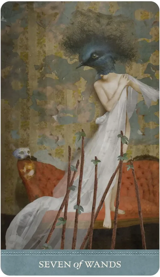 Card featuring a stylized figure with a bird head, draped in white, surrounded by wands on a textured background.