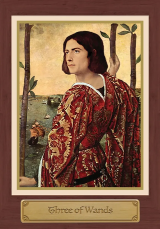 Card featuring a person in a red garment with 'Three of Wands' text, framed with a brown border.